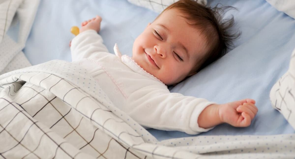 baby laughing in sleep